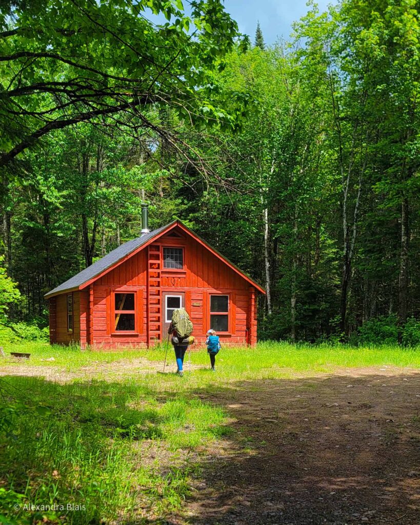 author and a kid by a mont tremblant refuges
