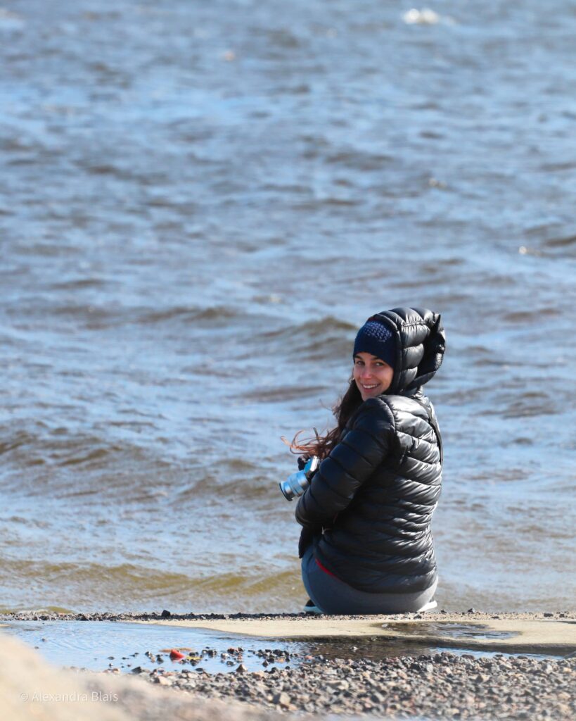 Author in James Bay by the water